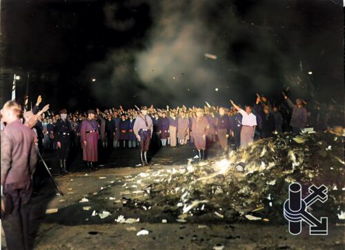 A towering heap of the Institute's books, reduced to ashes in a brutal act of censorship. This fiery destruction symbolizes the loss of knowledge and the erasure of voices that dared to challenge oppressive ideologies.